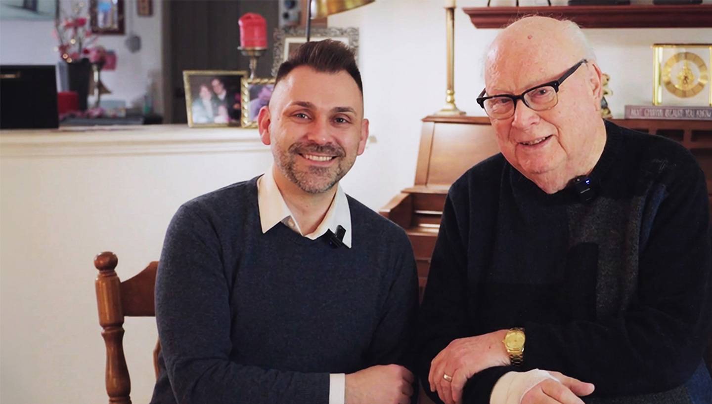 Two Men Sitting for Picture