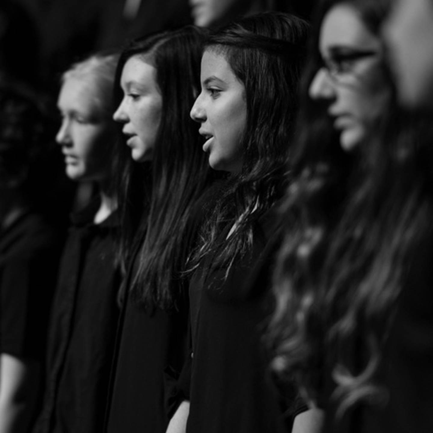 black and white image of music performers singing